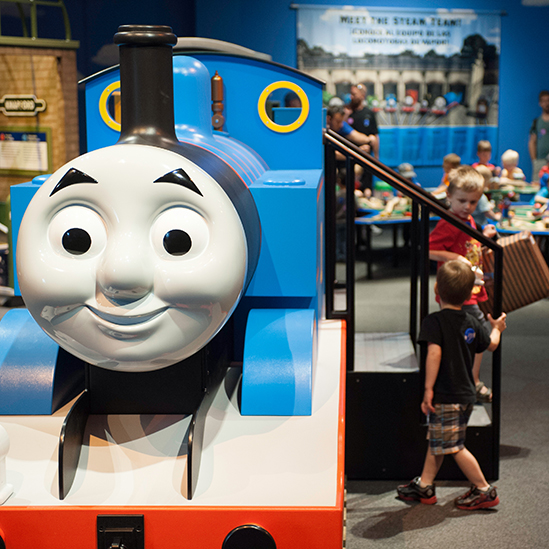 children playing on Thomas the train component